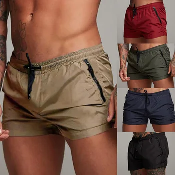 2022. gada vasarā jauns fitnesa sviedru absorbējošu vīriešu sporta bikses darbojas slim tīrtoņa krāsas rāvējslēdzēja kabatas, viduklis vīriešu šorti